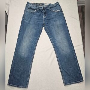 TK Axel Men's Slim Boot Cut Stretch Denim Jeans in a blue medium wash